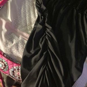 No brand tag. Solid black. Size 2-4